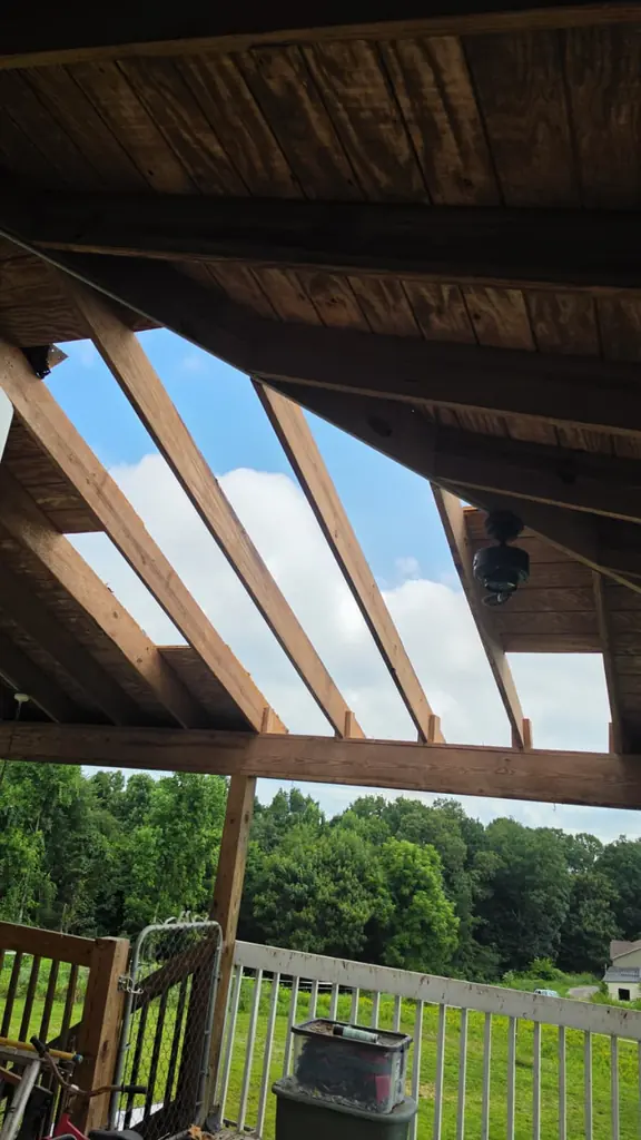 Covered porch roof framing with exposed rafters